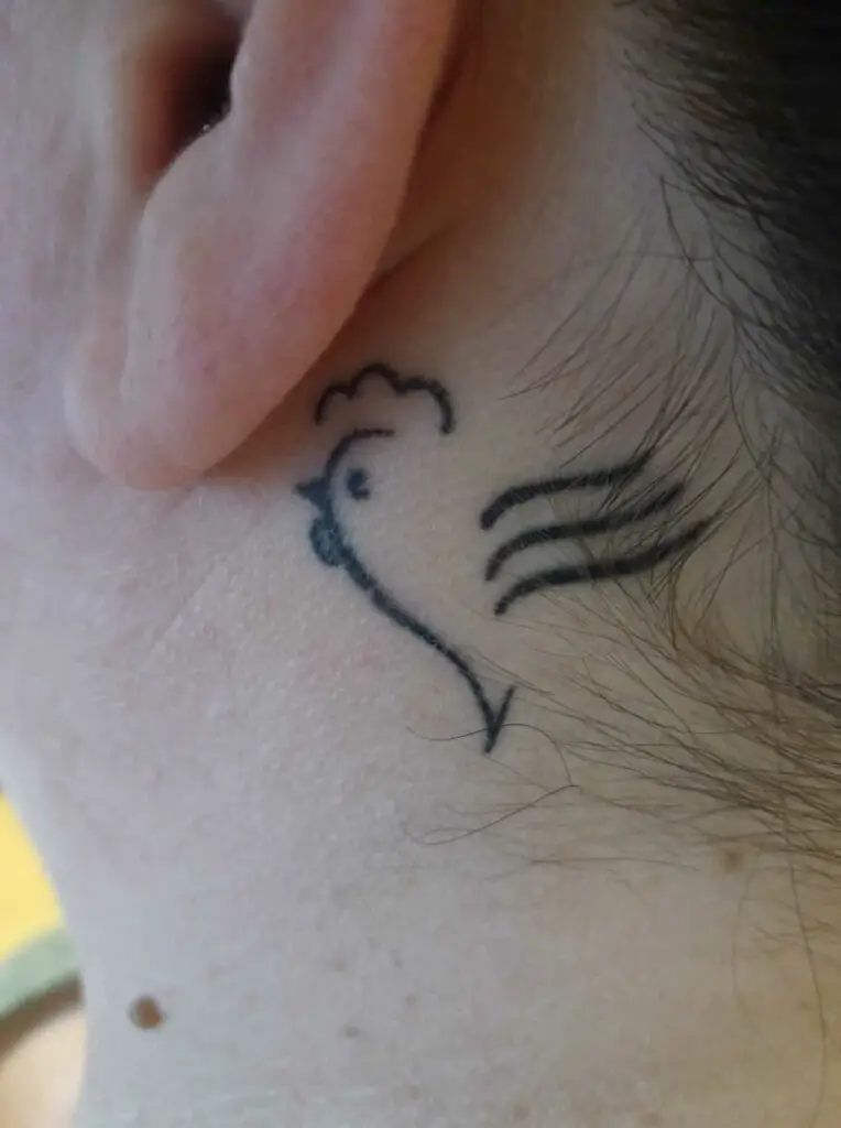 Chicken Tattoo Behind Left Ear