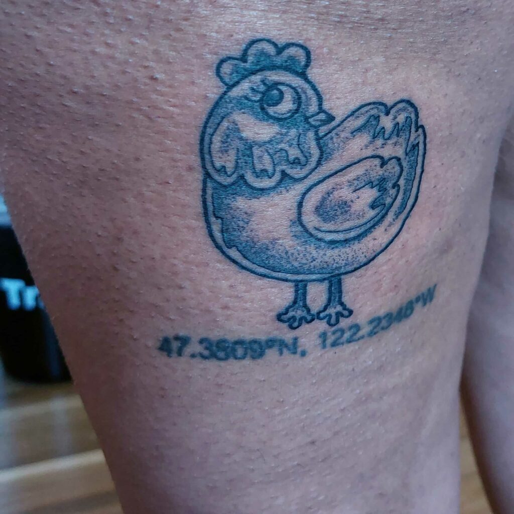 Chicken Tattoo Left Leg Below Buttock
